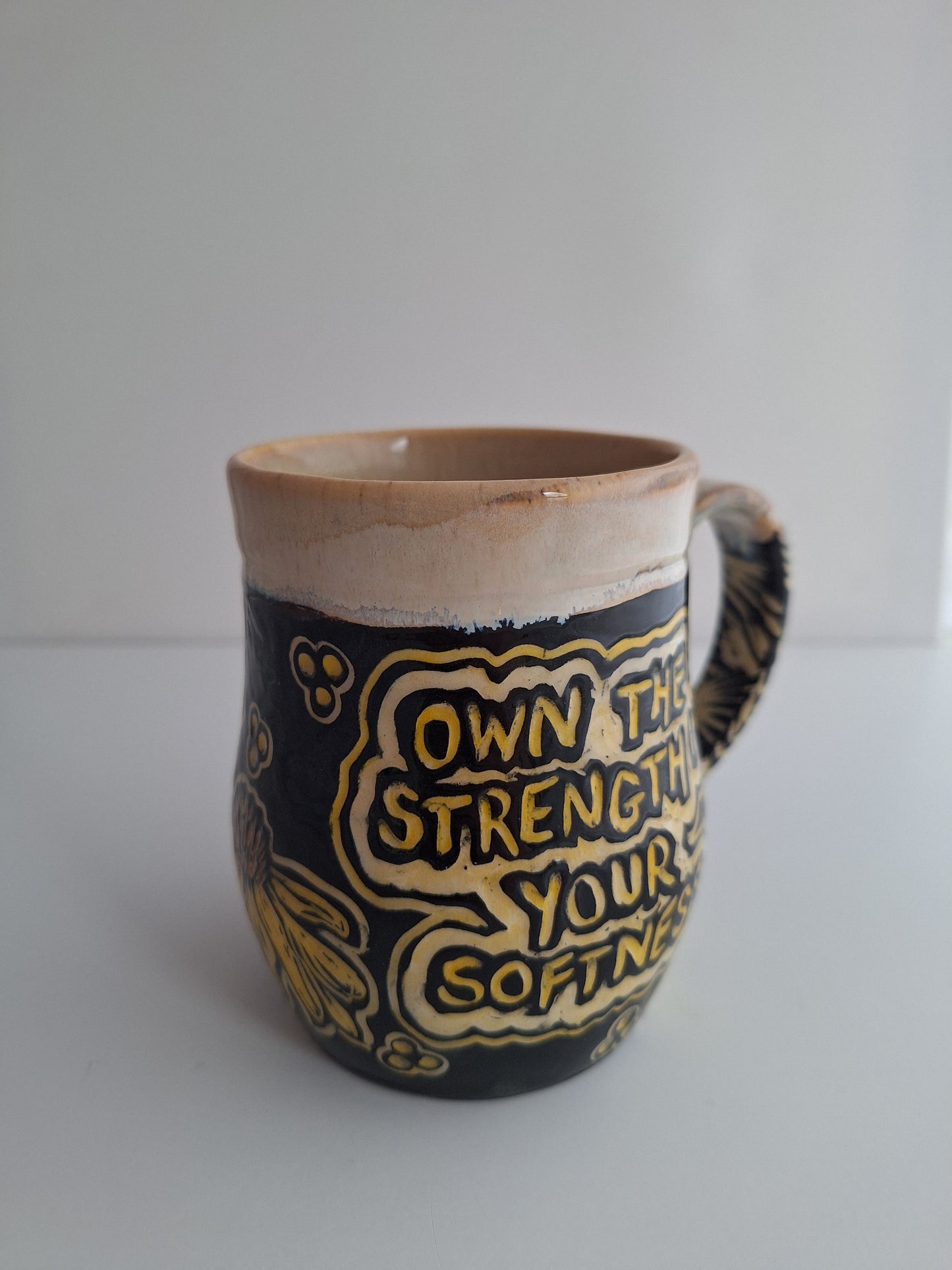Hand-carved Strength in Softness Mug