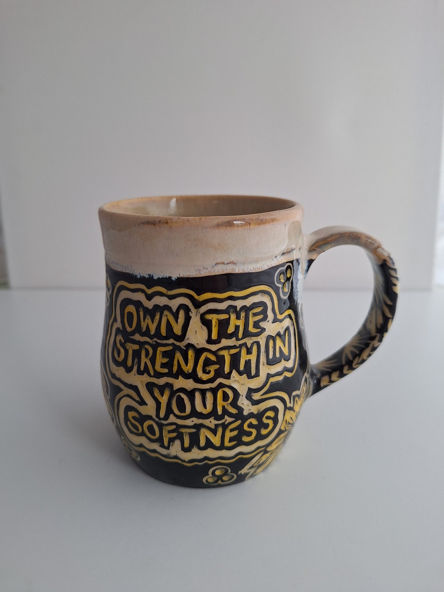 Hand-carved Strength in Softness Mug