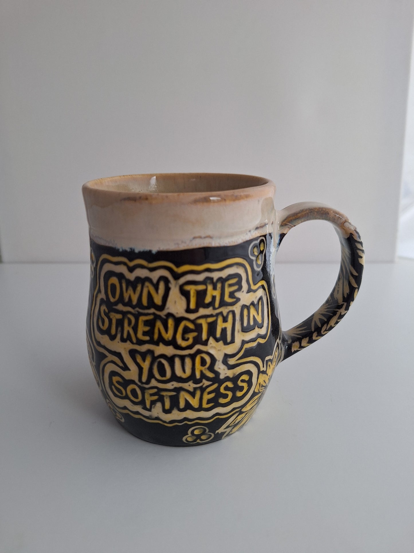 Hand-carved Strength in Softness Mug